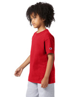A red short sleeve t-shirt for youth, featuring a logo on one sleeve.