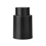 A black wine stopper with a sleek design, featuring a simple, tapered shape. It has a logo on its surface.