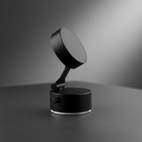 A black adjustable magnetic mobile stand with a round base and a swivelling top.
