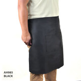 A black short waist apron features a front pocket, suitable for workwear purposes.