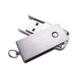 A silver metal flash drive with a sliding and swivelling mechanism, featuring a small keyring attachment.
