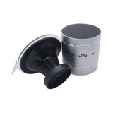 A silver vibration speaker with a suction base and control panel, featuring a sleek design.
