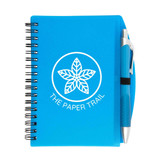 A blue spiral notebook with a pen attached, featuring a logo on the cover.