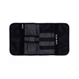 A grey toiletry roll with multiple compartments, mesh pockets, and zippers, featuring a logo.