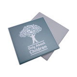 A square coaster in light blue featuring a tree design with icons and the text "Only About Children."