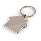 A zinc keytag shaped like a house, featuring a shiny metallic finish and a keyring attachment.