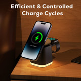 A magnetic wireless charger in black with a green light indicator, designed for phones and smartwatches.