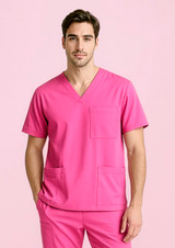 A unisex pink V-neck scrub top featuring short sleeves and multiple pockets, presented against a light pink background.