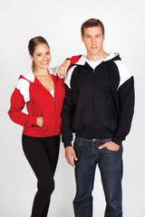 A black and red men's shoulder contrast zip hoodie worn by a man and a woman, both smiling. The hoodie has a logo.