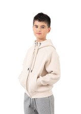 A beige hoodie with a zipper and kangaroo pockets, featuring a hood and a fitted design.