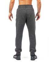 Men's brushed fleece track pants in dark grey, featuring an elasticised waistband and a logo on the back.