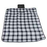 A Leisure Picnic Blanket featuring a classic black and white plaid pattern, designed for outdoor use.