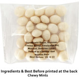 A clear packet containing white chewy mints, displaying ingredients and a logo on the packaging.