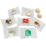 A variety of individually wrapped mints in different shapes and colours, featuring various logos on the packaging.