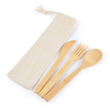 A bamboo cutlery set featuring a knife, fork, and spoon, all packaged in a calico pouch.
