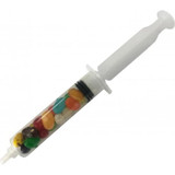 A syringe filled with multicoloured Jelly Belly jelly beans, showcasing vibrant reds, greens, yellows, and blues.