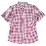 Short-sleeved button-up shirt in a maroon and white checkered pattern, featuring a branded label.