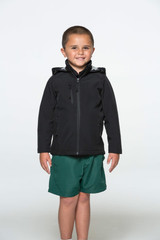 A child wearing a black jacket with a hood, paired with green shorts, standing against a plain background.
