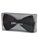 A black bow tie packaged in a clear box, featuring a logo on the front.