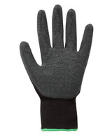 A black latex glove with a textured surface and a black wrist cuff featuring a green accent.