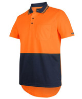 An orange and navy blue polo shirt with a drop tail design and a chest pocket, featuring a logo.