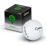 A white PGF Optima golf ball resting next to its black and green patterned box featuring a logo.