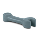 A grey stress relief toy shaped like a spanner, featuring a logo on one end.