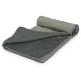 A rolled green cooling towel with a mesh texture, featuring a contrasting edge. It includes a pouch for storage.