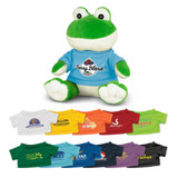 A green and white frog plush toy wearing a blue T-shirt, surrounded by various coloured T-shirts.