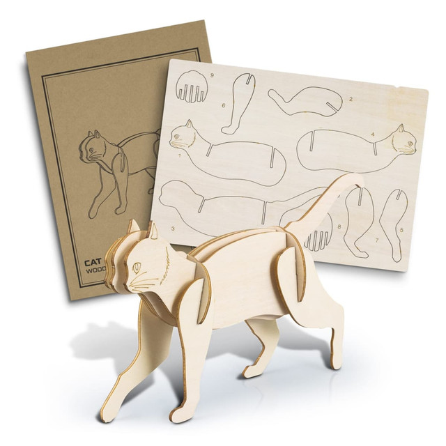 A wooden model of a cat in a natural finish, accompanied by a diagram sheet for assembly.