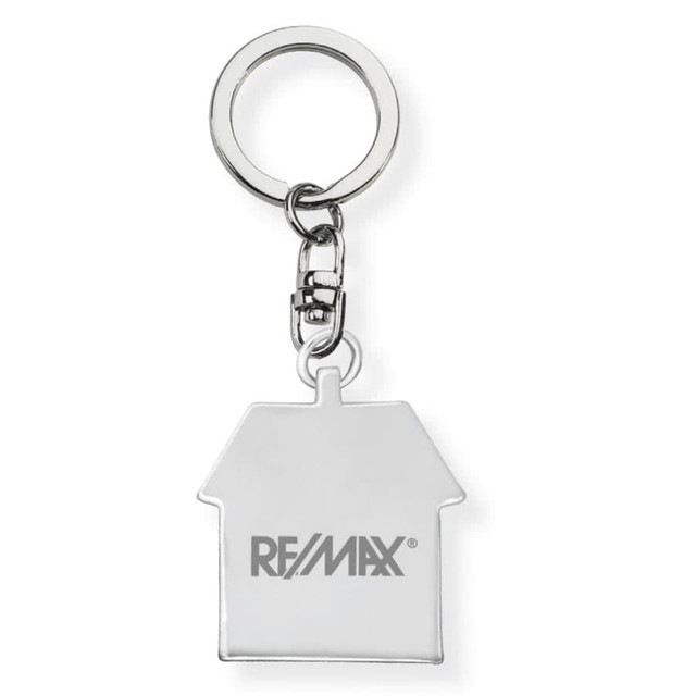 A silver keychain shaped like a house, featuring a logo, attached to a metal ring.