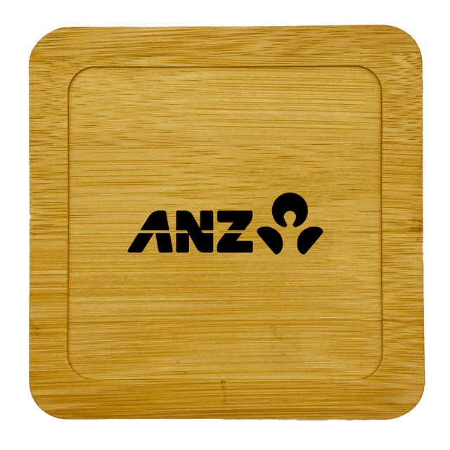 A bamboo coaster featuring a square design and a logo embossed in black.