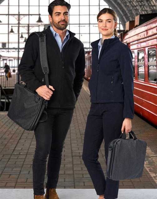 A black and grey laptop bag held by a man and a woman, both dressed in smart casual attire. The background features a train station.