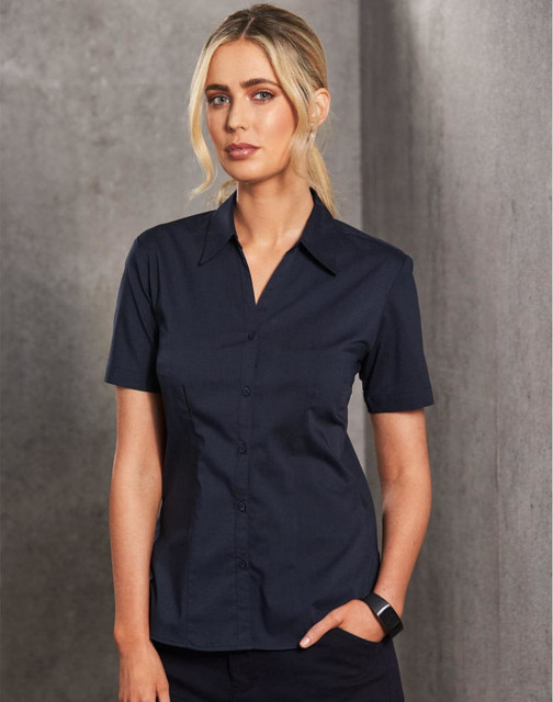 A short sleeve, navy button-up shirt with a fitted design, featuring a collar and a logo.