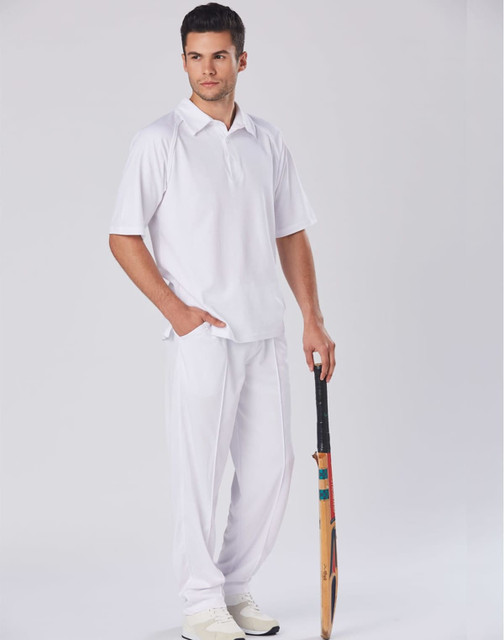 A white men's cricket polo shirt is displayed on a model holding a cricket bat, paired with white trousers.