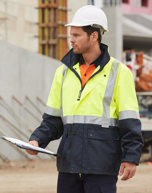 Hi-Vis two-tone rainproof safety jacket in yellow and navy, featuring 3M reflective tape, worn by a worker with a hard hat.