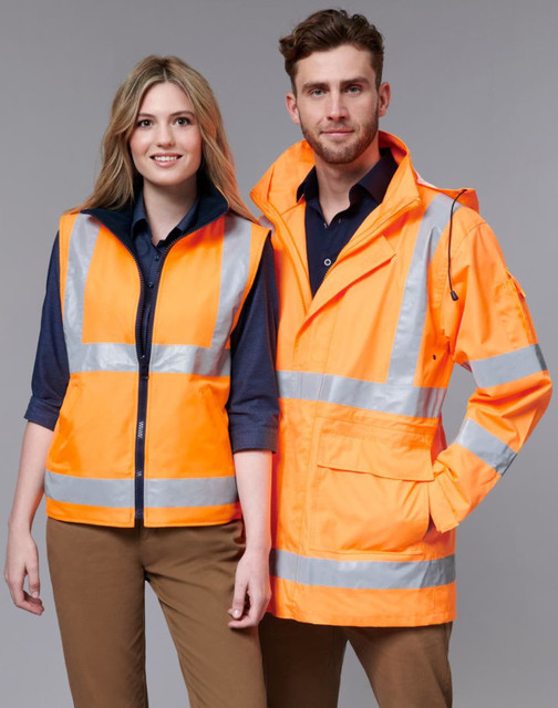 A safety jacket in bright orange with reflective stripes, displayed on two models, one male and one female.