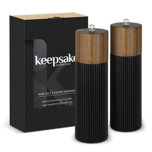 A set of black salt and pepper grinders with wooden tops, packaged in a sleek black box featuring a logo.