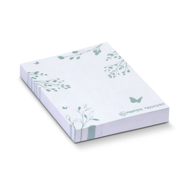A stack of recycled sticky pads in white with green leaf and butterfly designs, featuring 100 sheets.