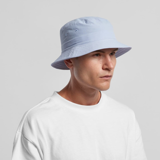 A light blue nylon bucket hat with a wide brim, featuring ventilation eyelets and a simple design.