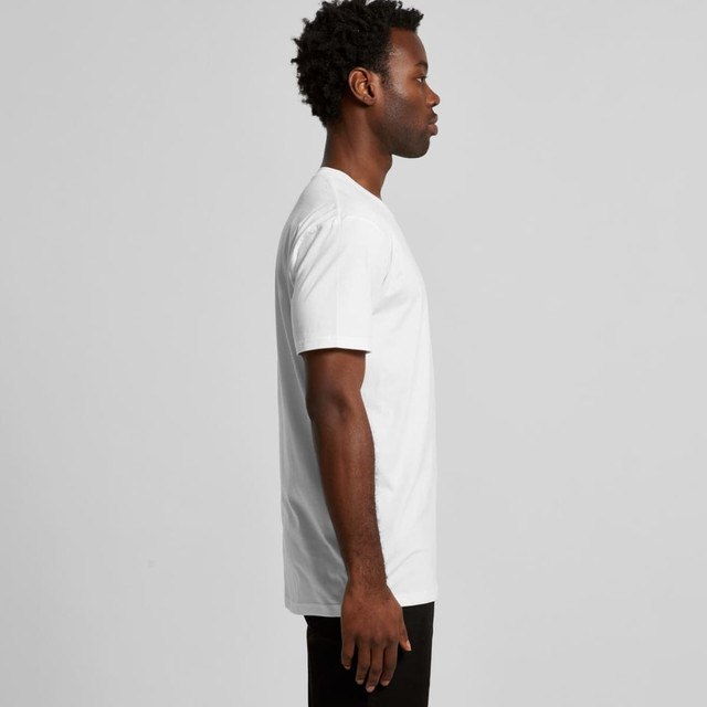A white Organic Tee shirt displayed on a model from the side, with short sleeves and a relaxed fit.