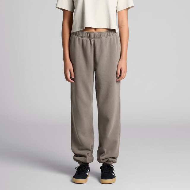 Faded grey track pants with an elastic waistband and cuffed ankles. The model is wearing a casual cropped top.