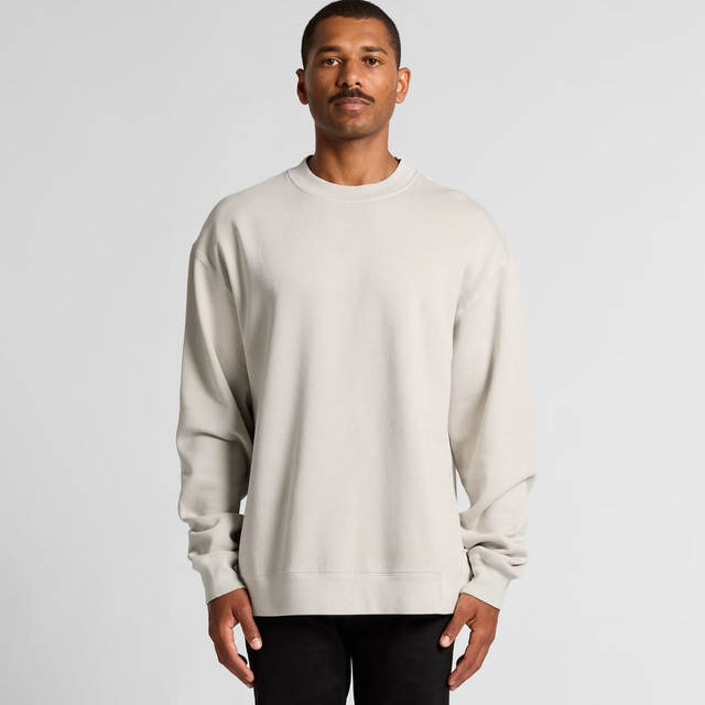 A beige crew jumper featuring long sleeves and a relaxed fit, displayed on a model against a neutral backdrop.