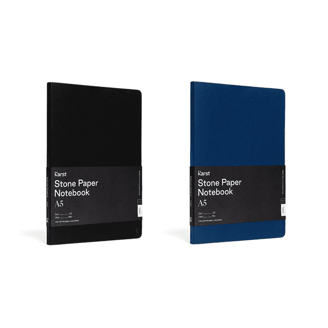 A5 softcover notebooks in black and blue, featuring a minimal design and a logo on the cover.