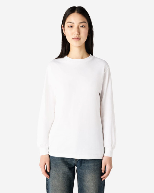 A heavyweight cotton unisex long sleeve T-shirt in white, displayed on a model with straight black hair.