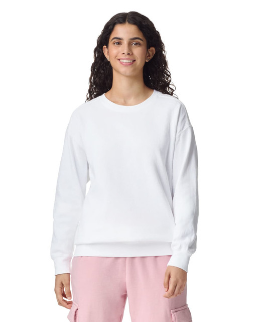A white adult crewneck sweatshirt featuring a relaxed fit and long sleeves, worn by a model.