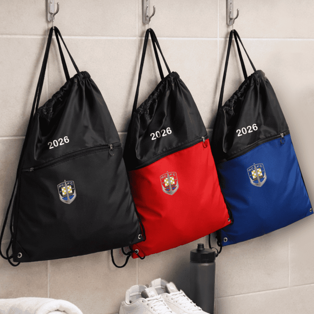 Three drawstring bags hang on hooks; one black, one red, and one blue, each featuring a logo and zip pocket.