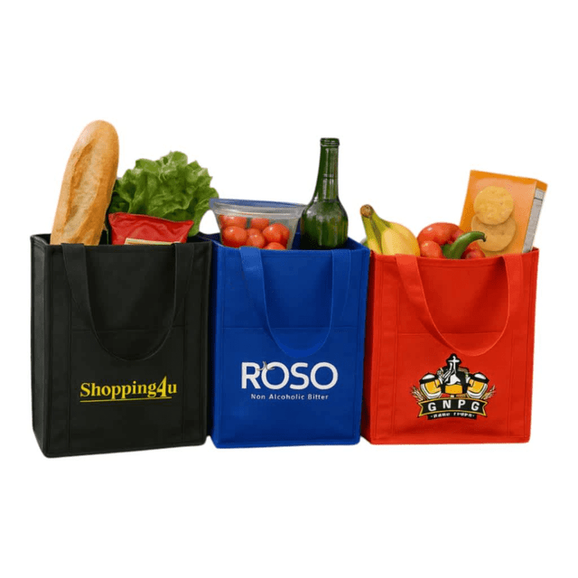 Three insulated grocery totes in black, blue, and red, filled with various groceries including fruits, vegetables, and a drink bottle.