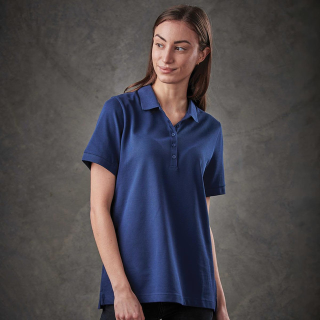 A navy women's polo shirt with a collar and short sleeves, featuring a logo on the front.