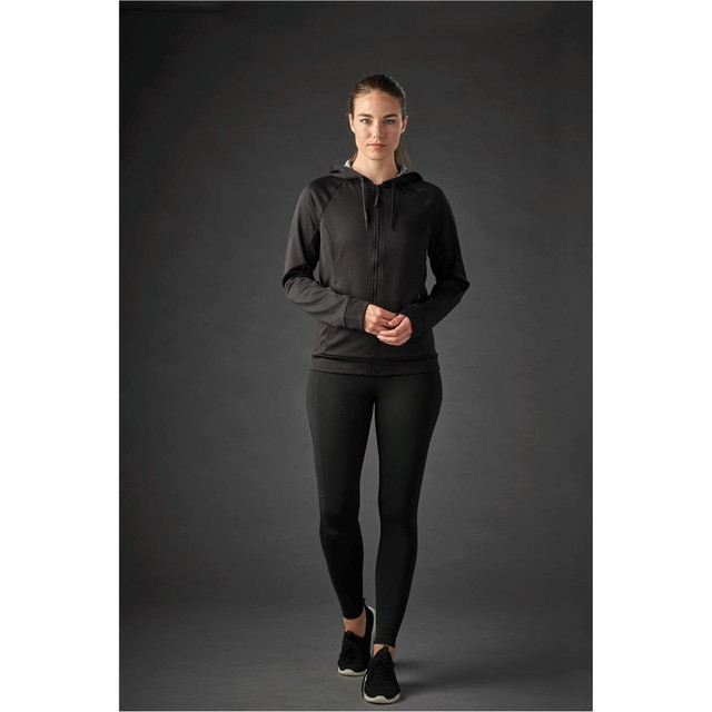 A women’s black Halifax hoody with a zip and hood, paired with black leggings, displayed on a model.